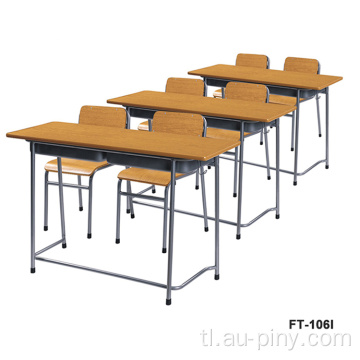 Double school student desk at chair bench